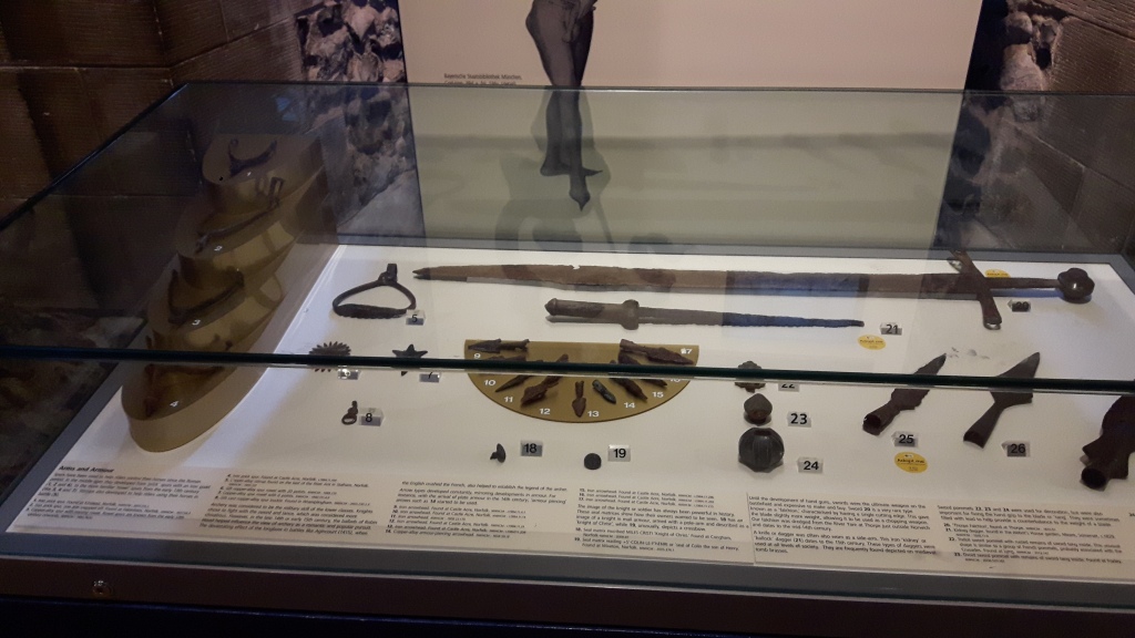 The Falchion lies in a display case in a photo taken in January 2018, alongside other objects including spearheads, arrowheads and a dagger